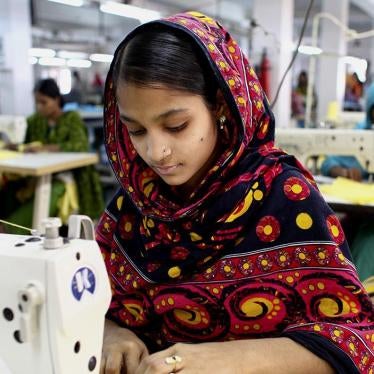“A garment worker sews clothing in a building near the site of the Rana Plaza building collapse” © 2014 G.M.B. Akash/Panos.