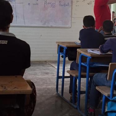 Syrian children attend class in a school in the Zaatari refugee camp in northern Jordan, October 20, 2015. The school taught Syrian girls in the morning and boys in the afternoon, but lacked electricity, heating, and running water. © 2016 Bill Van Esveld/