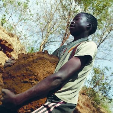 A 13-year-old boy digs for gold ore at a small-scale mine in Mbeya Region, Tanzania. 