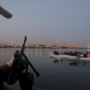 Migrants on a boat that they tried to take to Italy, after being detained at a Libyan Navy base in Tripoli on September 20, 2015.