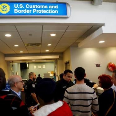 U.S. Customs and Border Protection officers stand outside an office during the travel ban at Los Angeles International Airport (LAX) in Los Angeles, California, U.S., January 28, 2017.