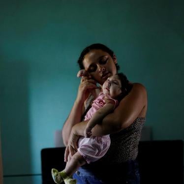Raquel, 25, holds her daughter Heloisa in Areia, Paraíba state, Brazil. Raquel gave birth to twin daughters with Zika syndrome in April 2016. “I want to give my best to my daughters,” she said in an interview with Human Rights Watch. 