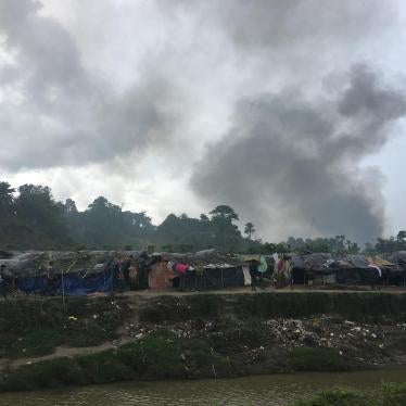 Smoke is seen rising from Burma’s Taung Pyo Let War village from across the border in Bangladesh.