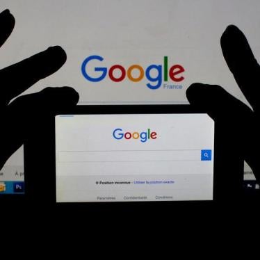 A woman holds her smart phone which displays the Google home page, in this picture illustration taken February 24, 2016.