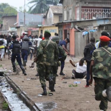 Security forces pursue peaceful protesters in Kinshasa, capital of the Democratic Republic of Congo, on December 31, 2017. © 2017 John Bompengo