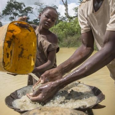 A girl works in an artisanal diamond mine in Sosso Nakombo, Central African Republic, near the border with Cameroon, in August 2015.