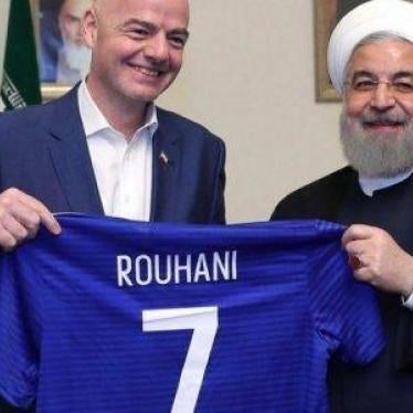 Iranian President Hassan Rouhani receiving a present from FIFA president Gianni Infantino during their meeting at the presidential office in Tehran, Iran, on March 1 2018. Handout photo, Iranian Presidential Office.Iranian President Hassan Rouhani receivi