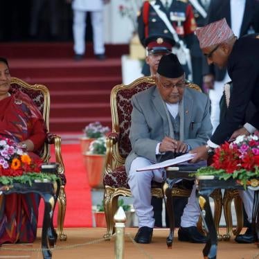 Nepal’s Prime Minister Khadga Prasad Oli signs the oath of office papers next to President Bidhya Devi Bhandari in Kathmandu, Nepal, February 15, 2018.