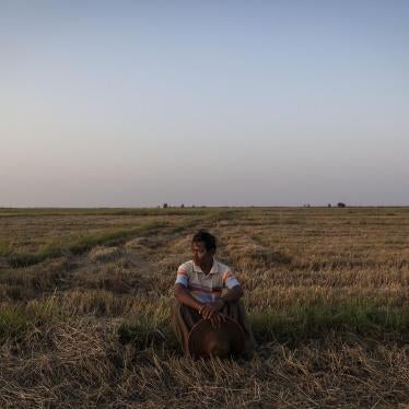 La Win, 61, a farmer from the Ayeyarwady Region, sits on a portion of the 35 acres of land he said was taken from him in 2004 by a company. When asked about the effect of the seizure of the land he said, “I suffered great losses in every aspect of my life
