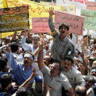 Iranian workers chant slogans during a May Day demonstration in front of the former US embassy in Tehran, May 1, 2006, protesting against the labor resolutions and their delayed payments. @2006 Behrouz Mehri/AFP/Getty Images