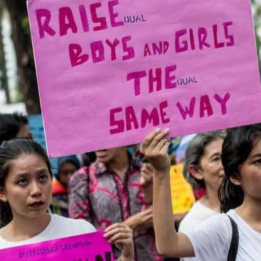 People take part in the 2018 Women's March rally in Jakarta on March 3, 2018. The participants were demonstrating for equal rights and an end to violence against women.