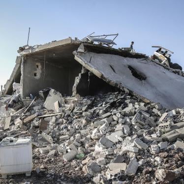 A man inspects the destruction left by overnight air strikes targeting residential areas at Kafr Nabl in the rebel-held Idlib Province, Syria, May 20 2019. 