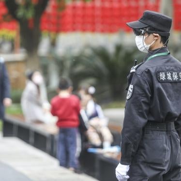 A security guard monitors people through his augmented reality eyewear equipped with an infrared temperature detector in Hangzhou, China, March 24, 2020.
