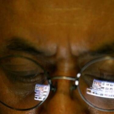 a Vietnamese man logs in internet for blogging on his iPad in Hanoi, Vietnam. 