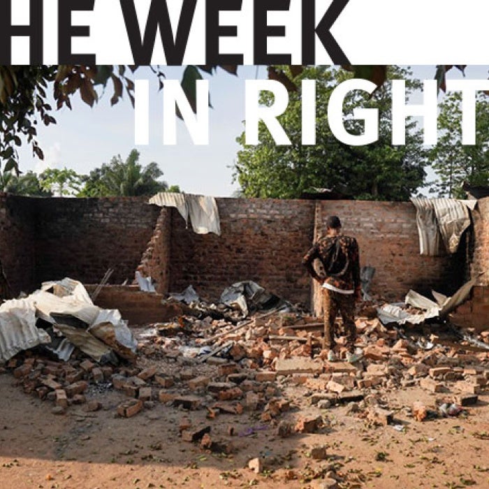 Man stands in rubble. 