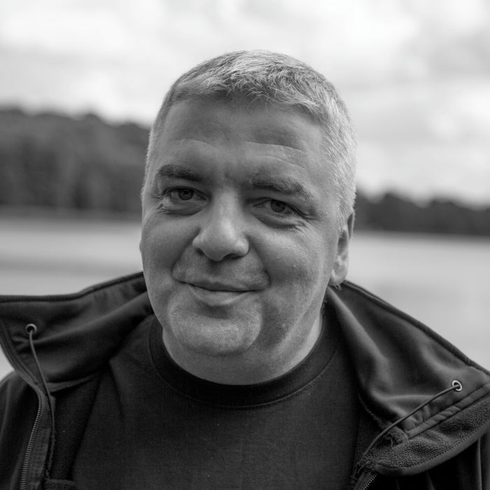 A man smiles in a photo